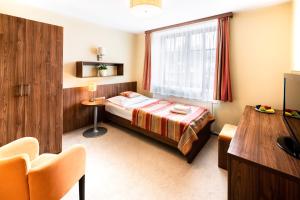 Voodi või voodid majutusasutuse Hotel Artaban toas