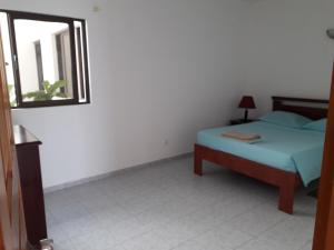 Postel nebo postele na pokoji v ubytování Ponta Gato Residence