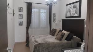 a bedroom with a bed and a window at Mariam Holiday House in Otranto +37 photos