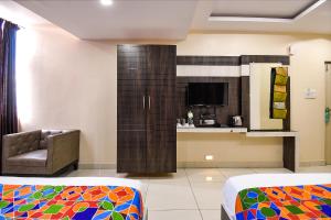 Voodi või voodid majutusasutuse FabHotel Rotano Suites - Yelahanka toas