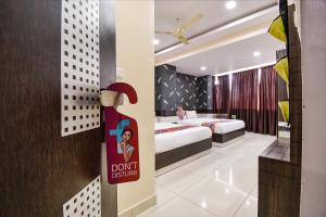 Voodi või voodid majutusasutuse FabHotel Rotano Suites - Yelahanka toas