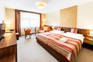 Voodi või voodid majutusasutuse Hotel Artaban toas