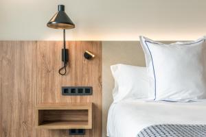 Postel nebo postele na pokoji v ubytování Hotel LIVVO Lumm