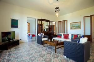 a living room with a couch and a tv at Property Son Marina in Palma de Mallorca