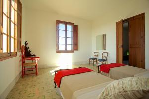 a room with two beds and a table and chairs at Property Son Marina in Palma de Mallorca +43 photos