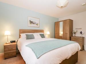 Ένα ή περισσότερα κρεβάτια σε δωμάτιο στο Derwent Haven +8 φωτογραφίες