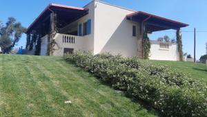 a house on top of a grassy hill at Mariam Holiday House in Otranto