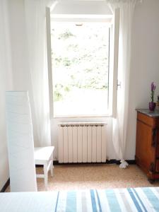 Postel nebo postele na pokoji v ubytování CASA ADRI. Comoda, accessibile, luminosa. + 1 fotografie
