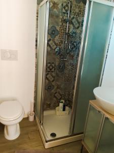 a bathroom with a shower with a toilet and a sink at la dimora degli angeli in Perugia +19 photos