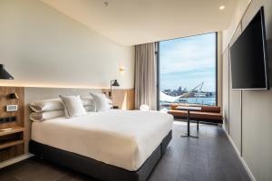Postel nebo postele na pokoji v ubytování Hotel LIVVO Lumm