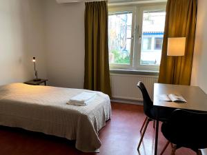 Postel nebo postele na pokoji v ubytování HOTEL N Hostel Malmö City