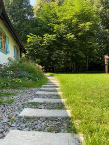 a stone path in front of a house at Bieszczadzka Samotnia in Cisna