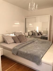 Postel nebo postele na pokoji v ubytování Apartman Ramljak