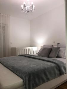 Postel nebo postele na pokoji v ubytování Apartman Ramljak