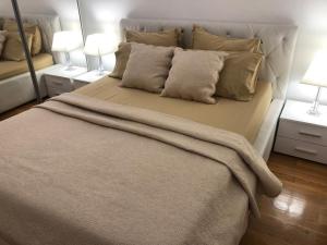 Postel nebo postele na pokoji v ubytování Apartman Ramljak