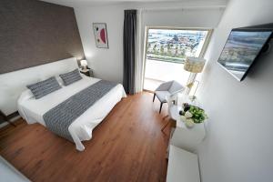 A bed or beds in a room at Hotel Matilde by Grupo Matilde