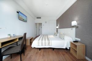 A bed or beds in a room at Hotel Matilde by Grupo Matilde