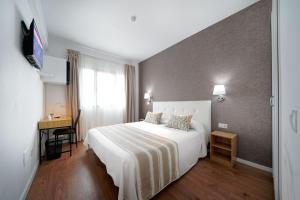 A bed or beds in a room at Hotel Matilde by Grupo Matilde