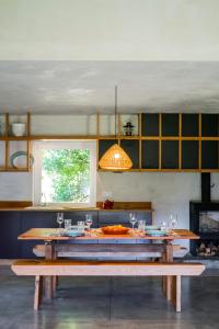 a kitchen with a table and a dining room at Quinta do Ameal - Wine & Tourism Terroir in Refoios do Lima