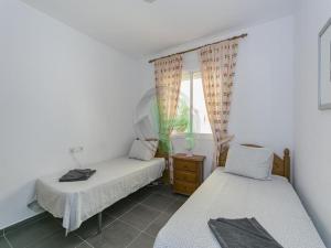 Łóżko lub łóżka w pokoju w obiekcie 3504 Imperial Park Spa Resort, Calpe