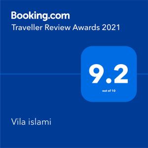 a screenshot of a phone with the travel review awards at Vila Islami in Durrës