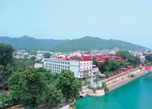 an aerial view of a city with a river at Hotel Ganga Aatitheyam in Haridwār