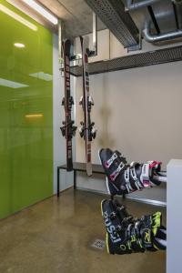 a pair of skis are hanging on a wall at Arena Franz Ferdinand Nassfeld in Tröpolach +140 photos