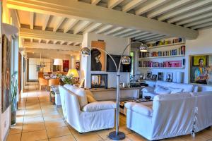 a living room with blue couches and a table at Villa Le Cave 12, Emma Villas in La Caduta