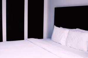 Katil atau katil-katil dalam bilik di Hotel Capitol