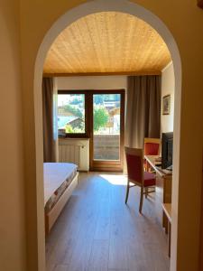 Postel nebo postele na pokoji v ubytování Hotel Garni LIVING