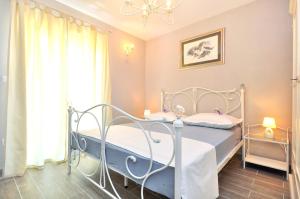 Cama o camas de una habitación en Apartments Sakal