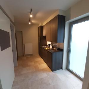 a kitchen with a sink and a counter top at Holiday Apartment Al 't Sanna in Geraardsbergen