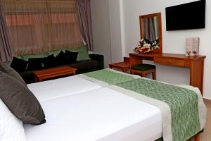 Postel nebo postele na pokoji v ubytování Hotel Residence Imiplage