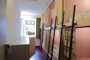 a room with bunk beds and a window at Maverick Budapest Soho in Budapest