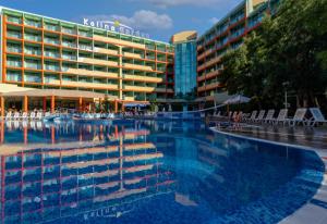 a large swimming pool in front of a hotel at MPM Hotel Kalina Garden - All Inclusive in Sunny Beach