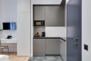 Kuchyň nebo kuchyňský kout v ubytování Centrooms Kropivnizkogo Mini-Hotel