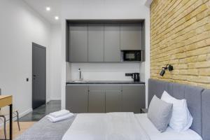 Postel nebo postele na pokoji v ubytování Centrooms Kropivnizkogo Mini-Hotel