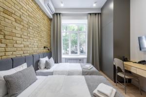 Postel nebo postele na pokoji v ubytování Centrooms Kropivnizkogo Mini-Hotel