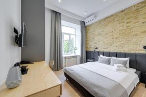 Postel nebo postele na pokoji v ubytování Centrooms Kropivnizkogo Mini-Hotel