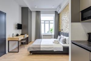 Postel nebo postele na pokoji v ubytování Centrooms Kropivnizkogo Mini-Hotel