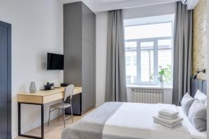 Postel nebo postele na pokoji v ubytování Centrooms Kropivnizkogo Mini-Hotel