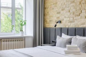 Postel nebo postele na pokoji v ubytování Centrooms Kropivnizkogo Mini-Hotel