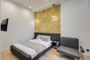 Postel nebo postele na pokoji v ubytování Centrooms Kropivnizkogo Mini-Hotel