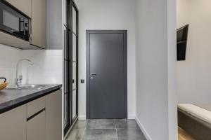 Kuchyň nebo kuchyňský kout v ubytování Centrooms Kropivnizkogo Mini-Hotel