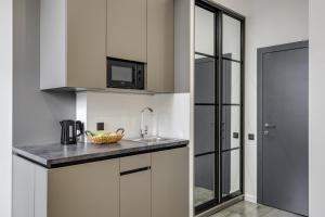Kuchyň nebo kuchyňský kout v ubytování Centrooms Kropivnizkogo Mini-Hotel