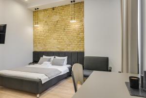 Ένα ή περισσότερα κρεβάτια σε δωμάτιο στο Centrooms Kropivnizkogo Mini-Hotel