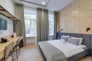 Postel nebo postele na pokoji v ubytování Centrooms Kropivnizkogo Mini-Hotel