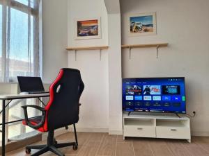 TV a/nebo společenská místnost v ubytování Corralejo beach apartment