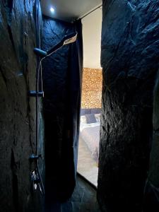 a bathroom with a shower with a shower curtain at Apartament & Spa Rosa in Istebna +17 photos