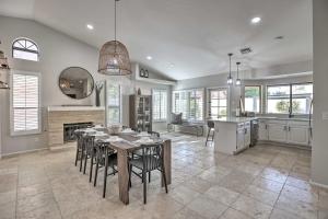 a kitchen and dining room with a table and chairs at Upscale Home with Pool Less Than 5 Mi to TPC Scottsdale! in Phoenix